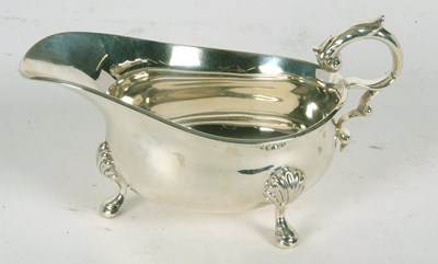 Lot 41 - A George V silver sauce boat of typical form...