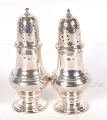 Lot 57 - Pair of silver casters of baluster form reeded...