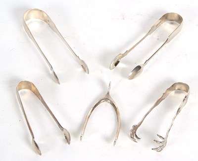 Lot 102 - Group of four pairs of silver sugar tongs, and...