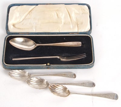 Lot 115 - A George V cased christening spoon and fork,...