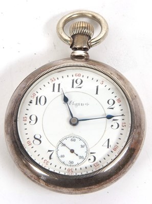 Lot 357 - An open face white metal Elgin pocket watch,...