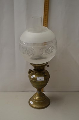 Lot 34 - A brass based oil lamp