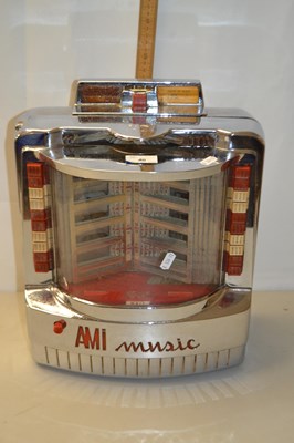 Lot 40 - A vintage AMI Music wall mounted juke box in...