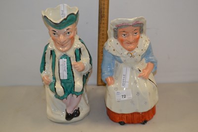 Lot 72 - A pair of 19th Century Staffordshire figural jugs