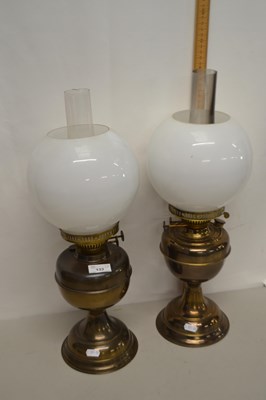 Lot 133 - Two brass based oil lamps