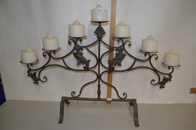 Lot 215 - Modern seven light iron candle stand