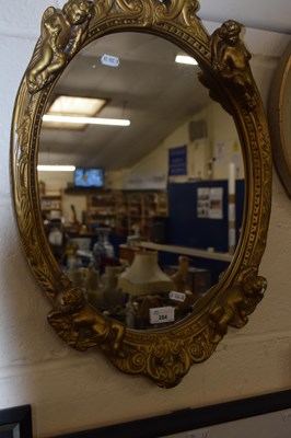 Lot 284 - Over wall mirror in plaster work frame