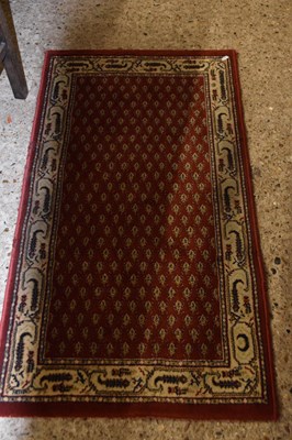 Lot 297 - Modern red patterned floor rug, 120cm long