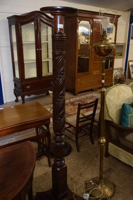 Lot 315 - A hardwood torchere plant stand with card...