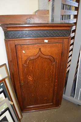 Lot 734 - George III oak corner cabinet with single...