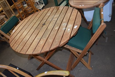 Lot 775 - Circular garden table and two folding chairs