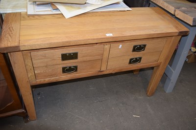 Lot 799 - Modern light oak four drawer side table, 120cm...