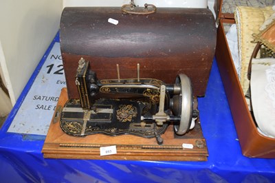 Lot 893 - Cased vintage sewing machine