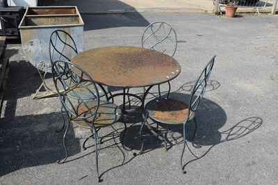 Lot 388 - Circular iron garden table and four chairs