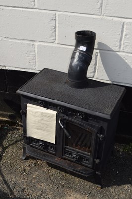 Lot 391 - Cast iron multi fuel stove with double doors,...