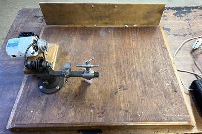 Lot 433 - An electric watchmakers lathe along with...