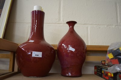 Lot 558 - Two red glazed pottery vases by Robert Maxwell...