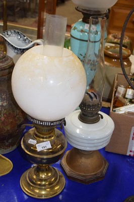 Lot 191 - Two oil lamps one with brass base the other...