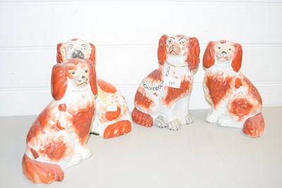 Lot 111 - FOUR VARIOUS STAFFORDSHIRE MODEL SPANIELS