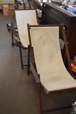 Lot 848 - Pair of pine and canvas folding deckchairs