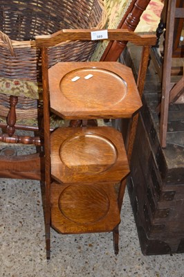 Lot 389 - Early 20th Century oak three tier cake stand