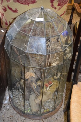 Lot 392 - Lead glazed glass terrarium with a dry flower...