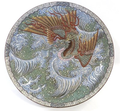 Lot 334 - An Oriental pottery charger with polychrome...