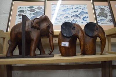 Lot 537 - Wooden elephant book end and a pair of carved...