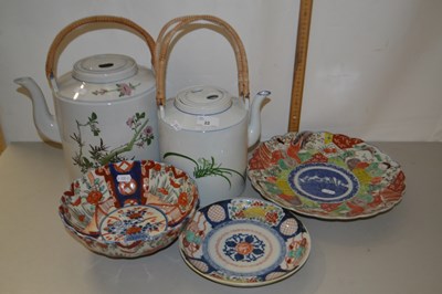 Lot 22 - Two Japanese porcelain kettles with wicker...