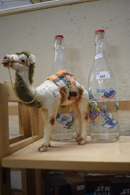 Lot 631 - Two Smurf bottles together with a novelty camel