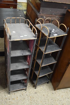 Lot 360 - Two similar narrow cane shelf units, each...