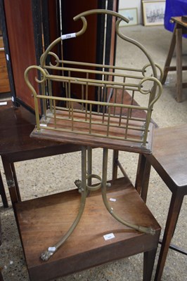 Lot 388 - Brass rotating magazine rack, raised on a...