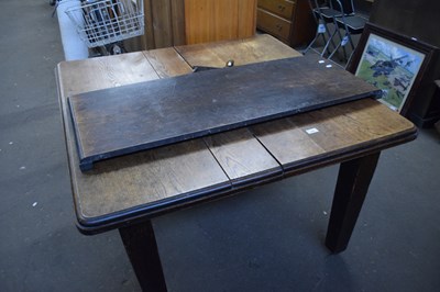 Lot 785 - Extending dining table with extra leaf and winder