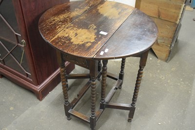 Lot 800 - An oval drop leaf side table with turned legs