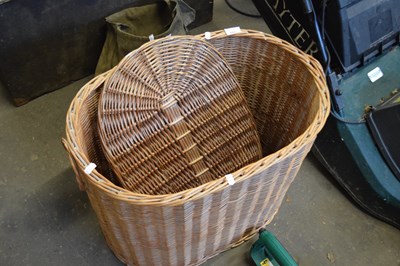 Lot 848 - An oval wicker laundry basket