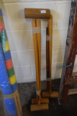 Lot 870 - Four croquet mallets