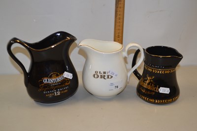 Lot 78 - Three assorted whisky jugs