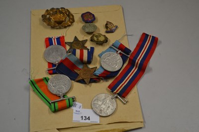 Lot 134 - Quantity of British Service Medals, cap badges...