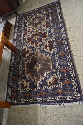 Lot 428 - Blue and red ground rug