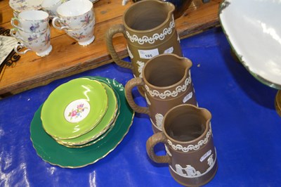 Lot 185 - Graduated set of pottery jugs with applied...