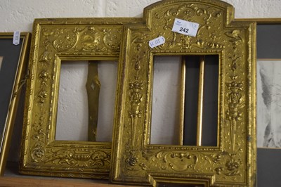 Lot 242 - Two similar gilt metal Repousee picture frames