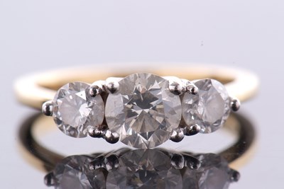 Lot 369 - An 18ct three stone diamond ring, the three...