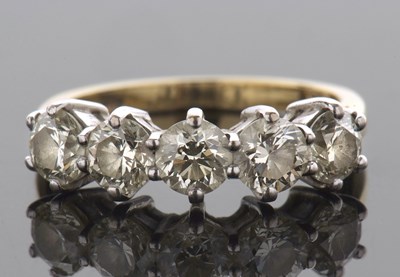 Lot 370 - An 18ct five stone diamond ring, the five...