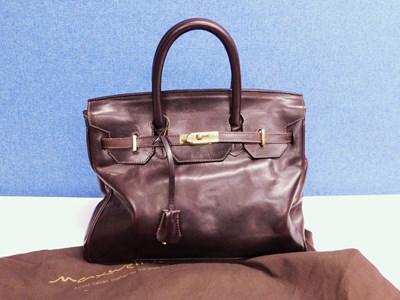 Lot 631 - A dark brown leather bag by Maxwell Scott,...