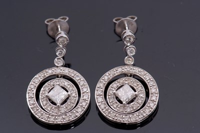 Lot 372 - A pair of 18ct white gold diamond earrings,...