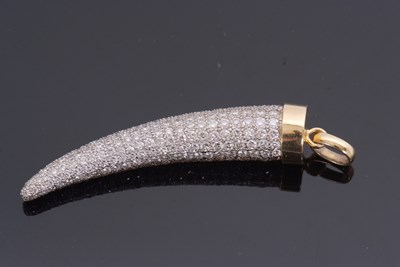 Lot 373 - A bi-colour diamond set horn pendant, the...