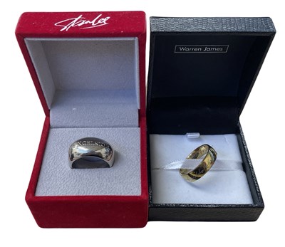 Lot 429 - A pair of boxed replica plated rings, to...