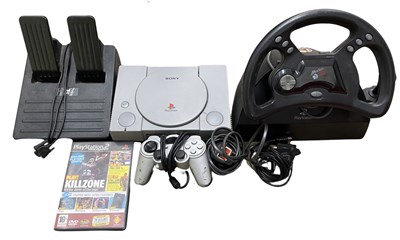 Lot 359 - A Playstation 1 console, together with: - Mad...