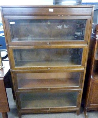 Lot 531 - Stacking four-tier bookcase cabinet marked...