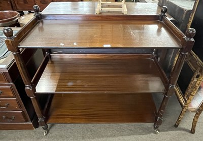 Lot 534 - 20th century mahogany veneered three tiered...